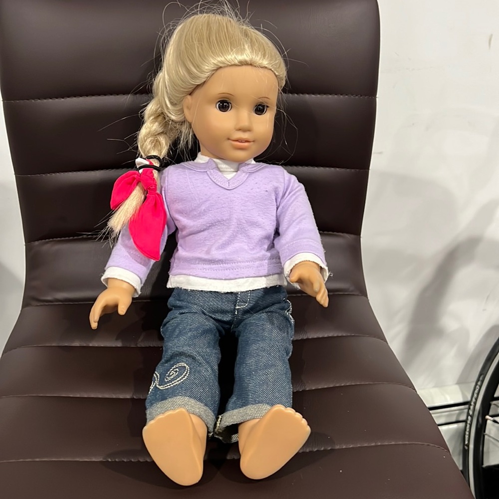 American Girl Doll with Lavender Top and Pink Hair Ribbon